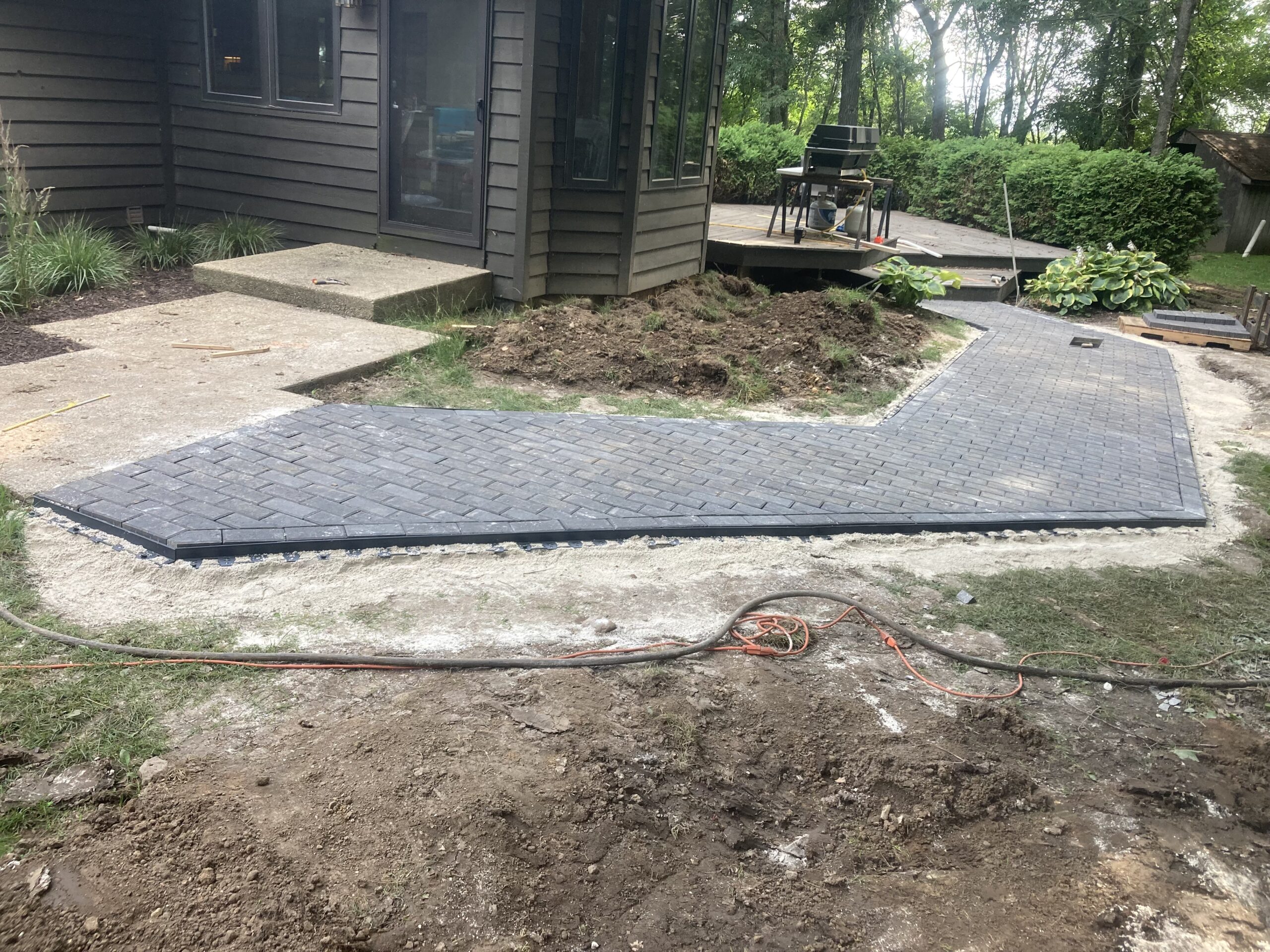 Paver patio installation with drainage prep