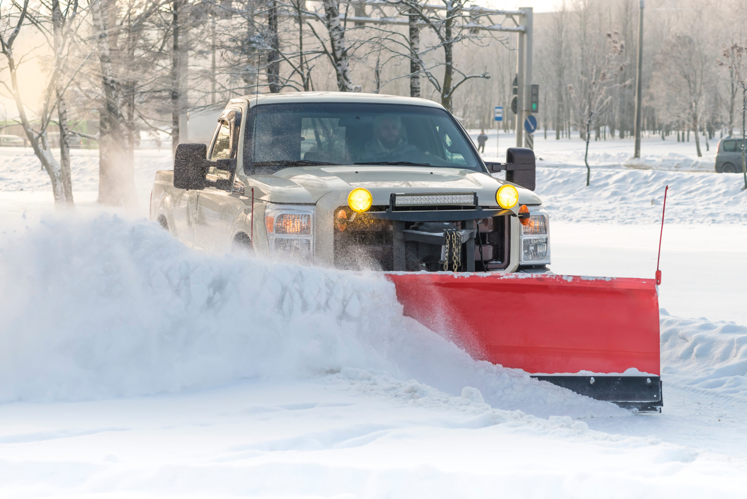Snow-covered driveway and walkway cleared after a winter storm